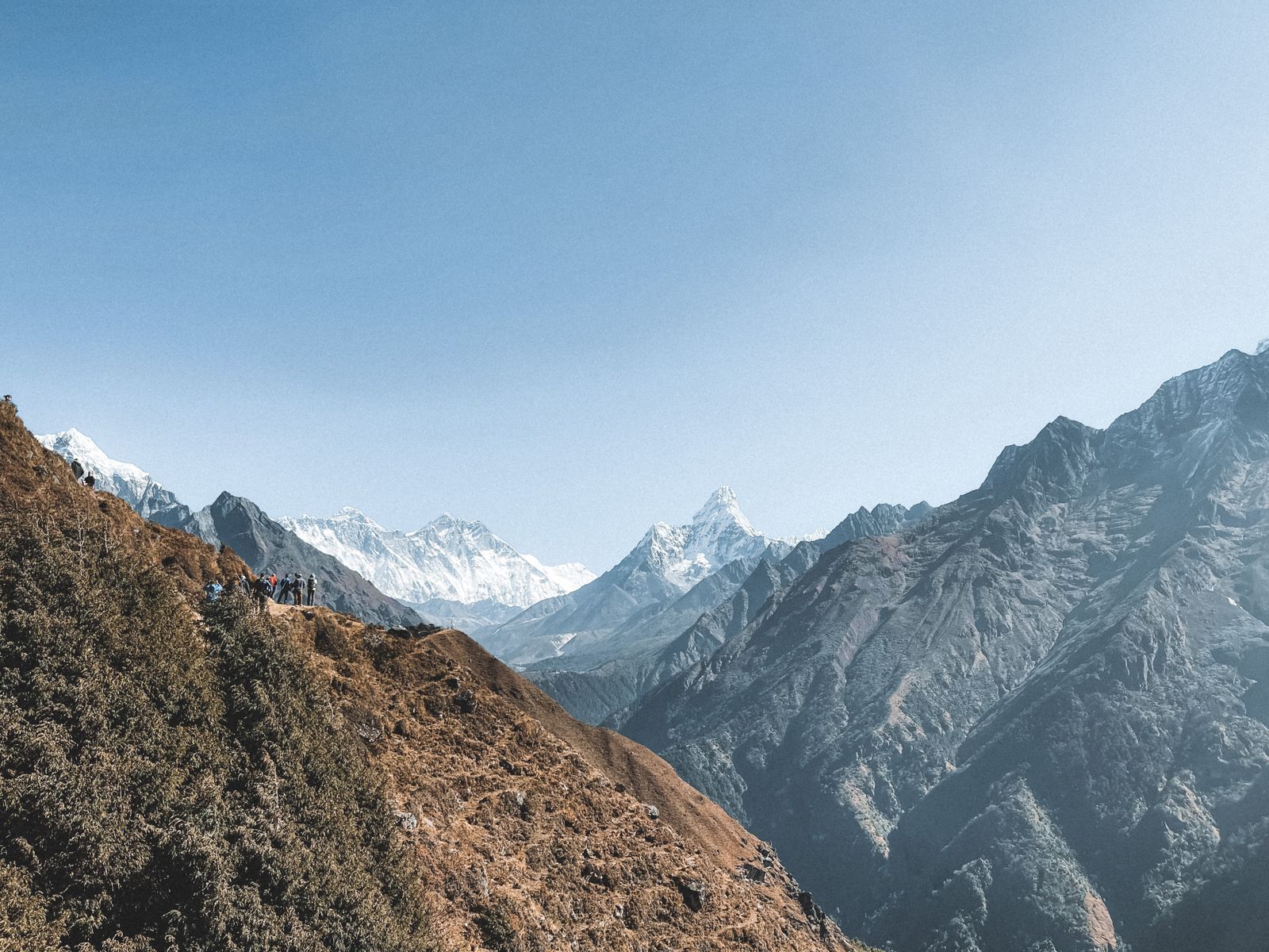 Trekkers on a Himalayan mountain path in Nepal, a famous trekking country